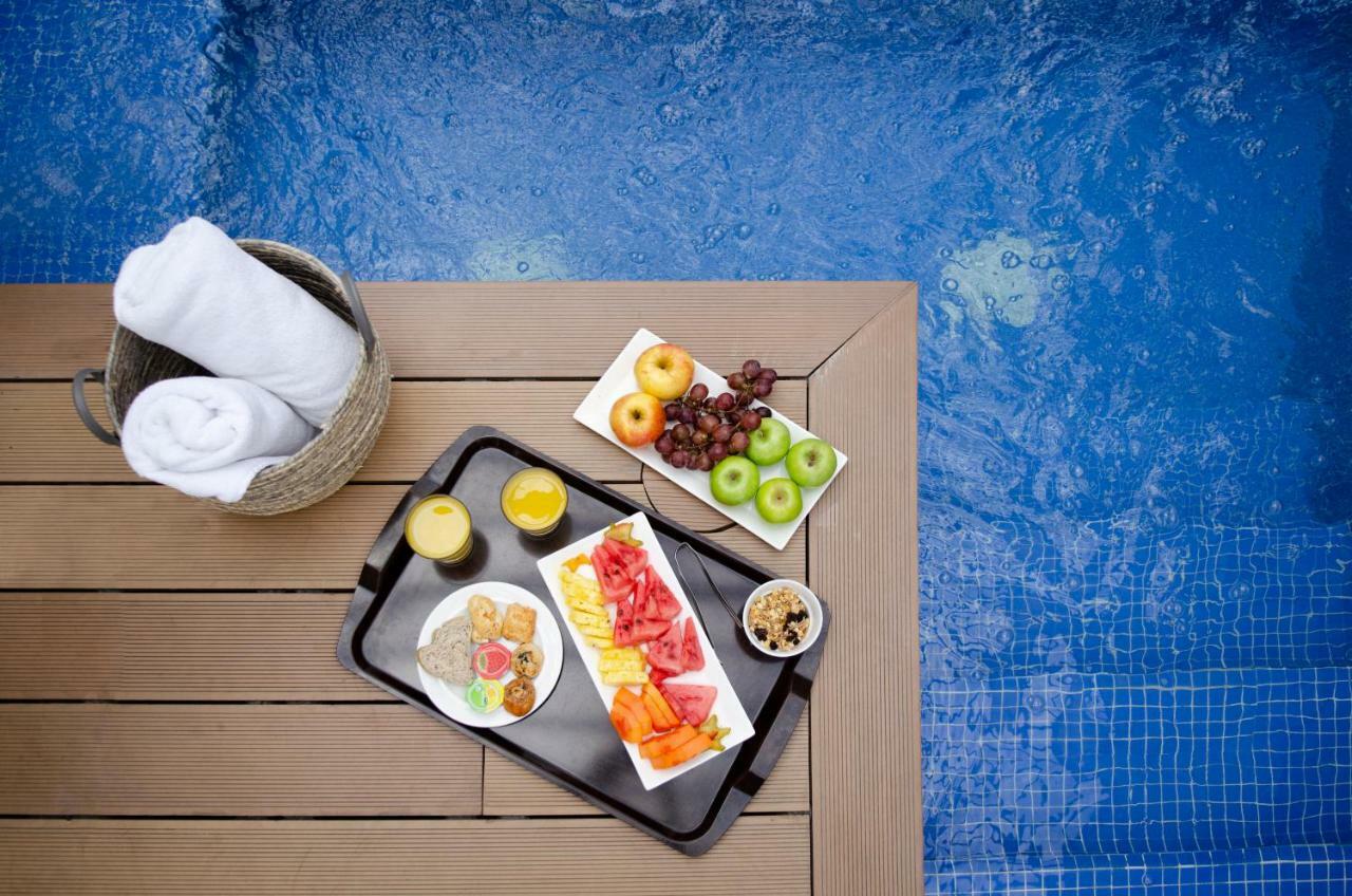 Quo Quality Hotel Manizales Extérieur photo A poolside snack